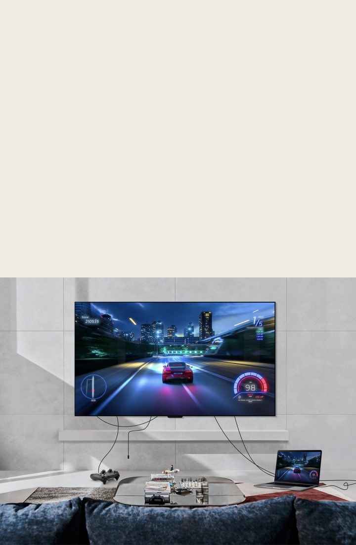 LG OLED evo M4 mounted on a living room wall and a games console and laptop connected by messy wires across the room. The console and laptop fade out, then fade in neatly organised with a Zero Connect Box on a table. A red Wi-Fi signal appears and a red beam emits towards the TV and red circles eminate.	