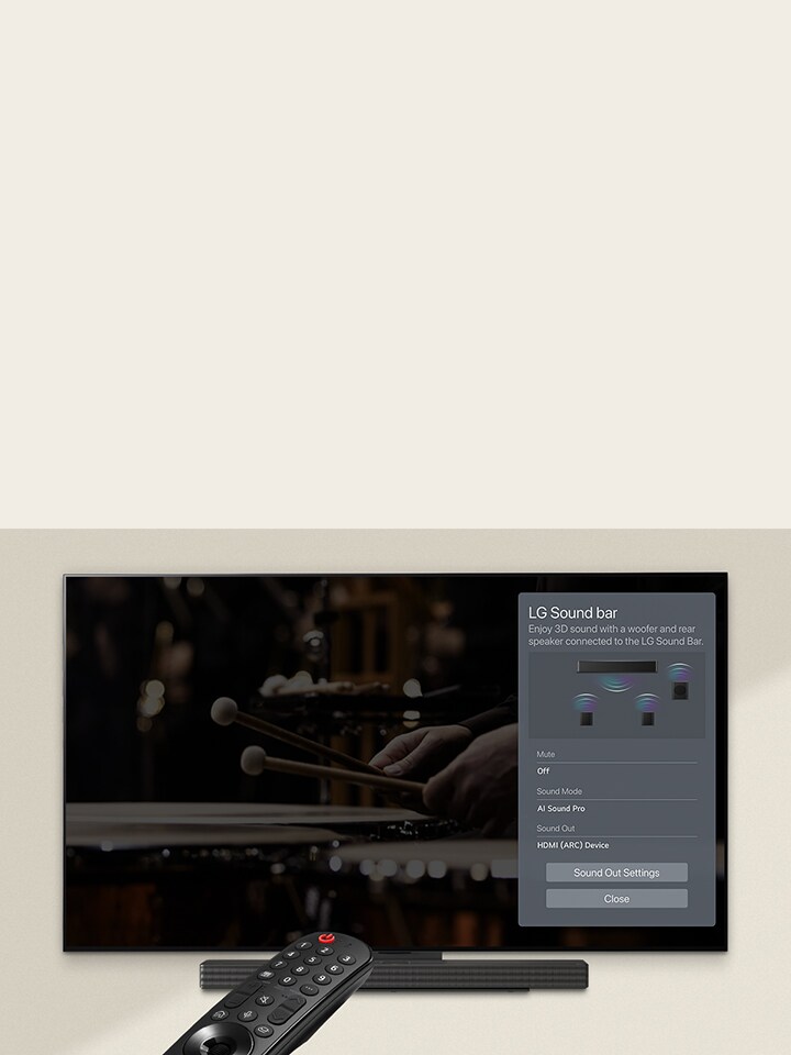 An image of a remote control pointed at an LG OLED TV showing soundbar control settings on the right side of the screen.