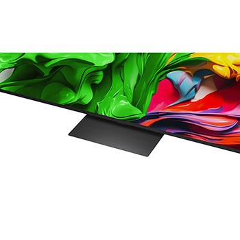 A girl and a dog are seated in front of a LG QNED TV mounted on a wall depicting three elephants walking outwards above a LG Soundbar. The title talks about how every action is more thrilling on a massive screen.