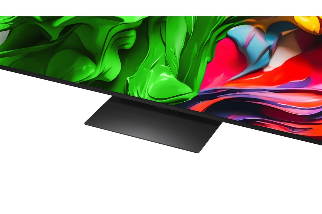 A girl and a dog are seated in front of a LG QNED TV mounted on a wall depicting three elephants walking outwards above a LG Soundbar. The title talks about how every action is more thrilling on a massive screen.