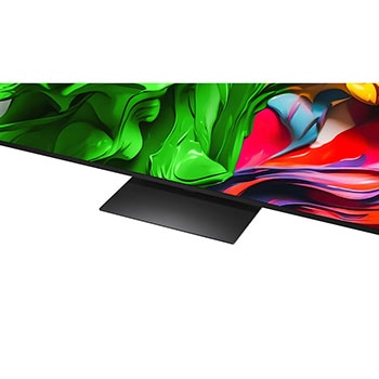 A girl and a dog are seated in front of a LG QNED TV mounted on a wall depicting three elephants walking outwards above a LG Soundbar. The title talks about how every action is more thrilling on a massive screen.