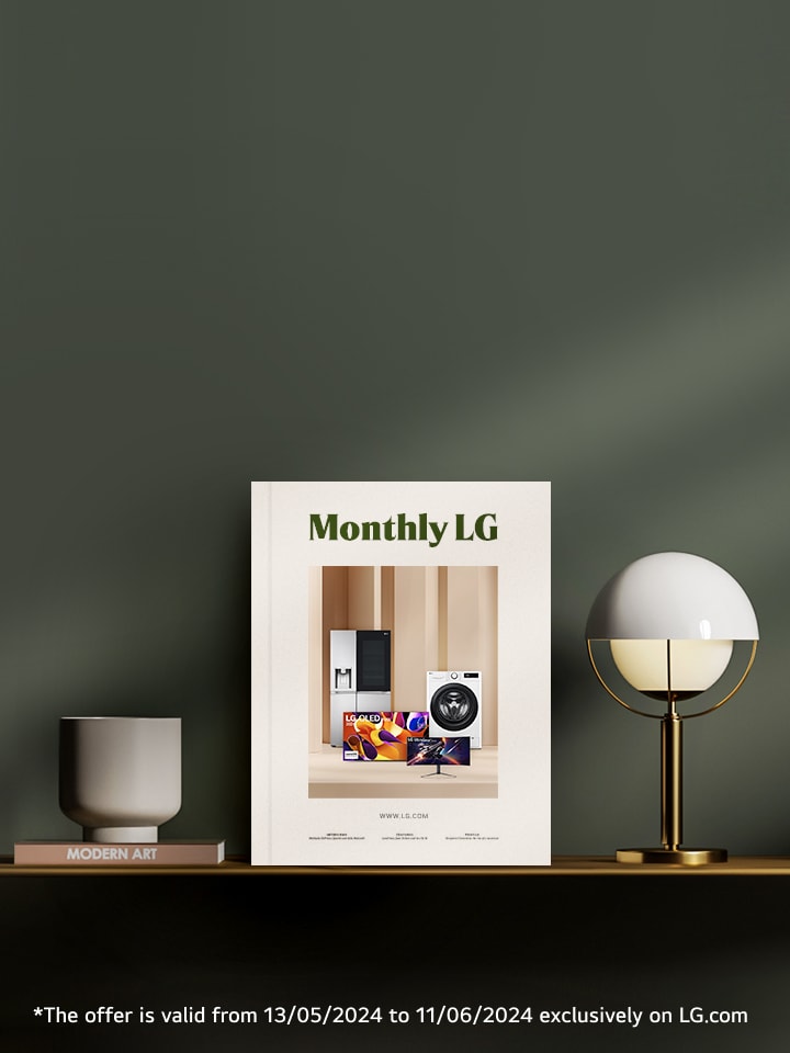 monthly lg book cover standing on a smart sideboard over a dark green wall