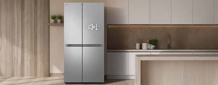 LG refrigerator with a sleek silver finish standing in a modern kitchen, showing a sound-reduction icon on the door.