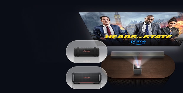 LG Cinebeam projecting Head of State onto wall, with 2 LG xboom speakers