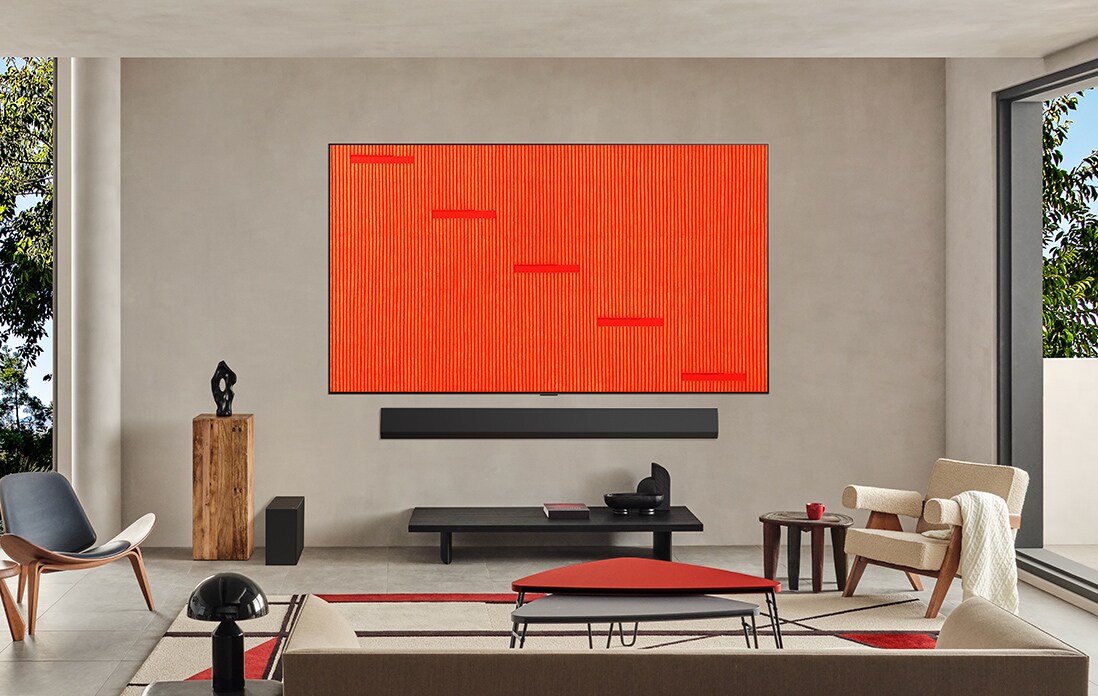 Living room with a wall-mounted LG TV. The screen features one of the many artworks available on LG Gallery+ 
