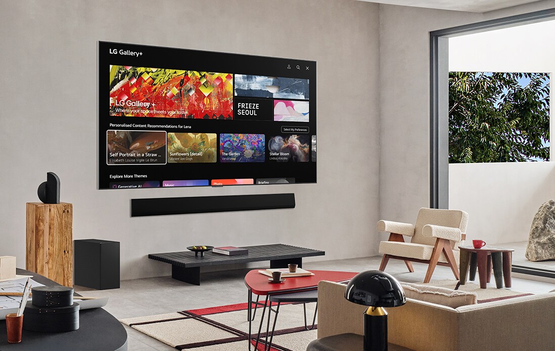 Living room with a wall-mounted LG TV. On the screen is the LG Gallery+ home screen.