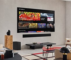 Living room with a wall-mounted LG TV. On the screen is the LG Gallery+ home screen.