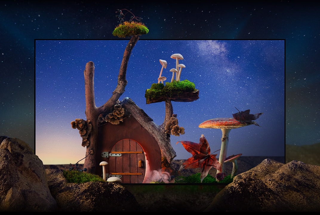 A fantastical-looking tiny house with trees, mushrooms, and large rocks is under the starry night sky.