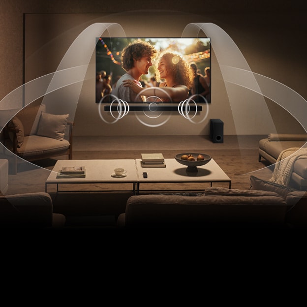 Dimly lit, cosy living room with a LG QNED TV on a wall with a LG Soundbar. Graphics show how Dolby Atmos fills the whole space with surround sound from all directions. Dolby Atmos logo is at the bottom right corner.