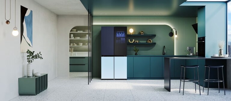 Modern kitchen with sleek teal cabinetry, an LG MoodUP refrigerator with a gradient door, open shelving, minimalist decor, and a large island with bar stools. Natural light floods the space through a large window.