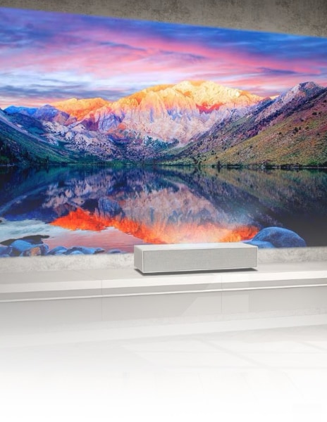 lg projector with a mountain view projected on a large wall