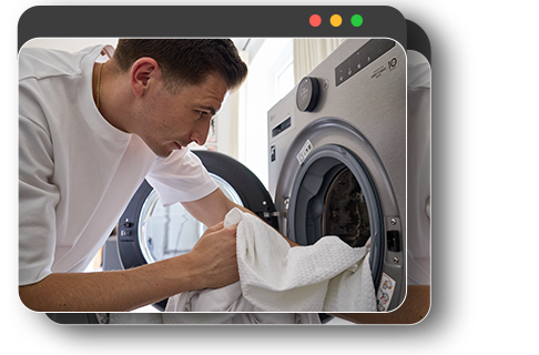 User putting clothes into washing machine and using smartphone app to start the wash remotely.