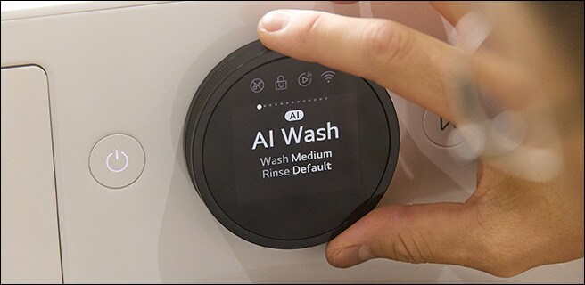 A man setting up the washing machine