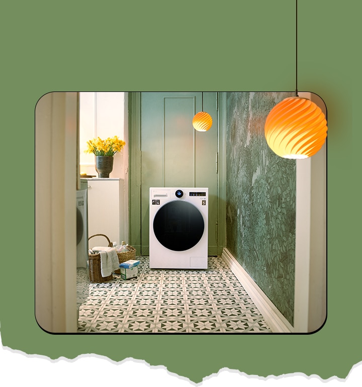 The washing machine is shown in the front and there is a yellow flower basket and laundry basket next to it.