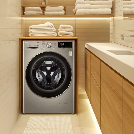 Well-dried towels are folded and placed neatly on top of the LG washing machine.