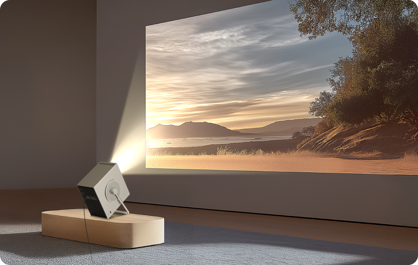 LG CineBeam Q projector displaying a scenic sunset view on a wall in a cozy living room.