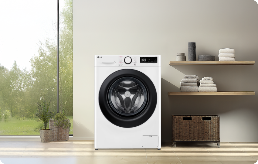 LG washing machine in a bright, modern laundry room with stylish shelving.