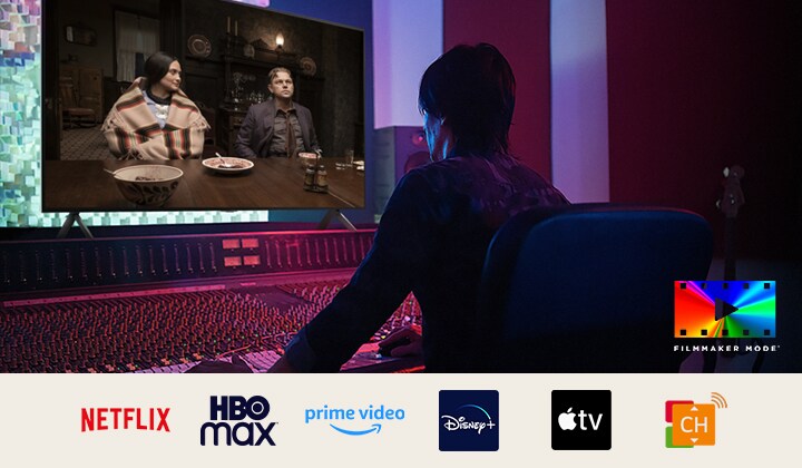 A director in front of a control panel editing the movie "Killers of the Flower Moon" on an LG QNED TV. In the bottom left, the Dolby Vision logo and FILMMAKER MODE logo. Below the image are logos for Netflix, HBOmax, Prime Video, Disney Plus, Apple TV and LG Channels. 	
