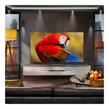 A family sits on a couch facing a LG QNED TV sitting above a TV stand with a little girl pointing to a screen depicting two dolphins. The title talks about how you can enjoy high resolution on a massive screen.