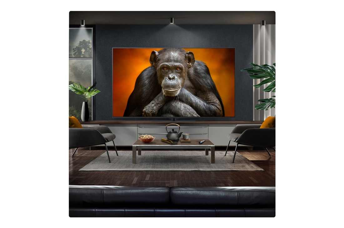 Campfire at night in the middle of nature. In the distance is a forest and lake. The evening sky is filled with stars. The whole scene is split in half. One side is darker and duller. The other half is remarkably brighter, showcasing the impressive brilliance from Brightness Booster. 