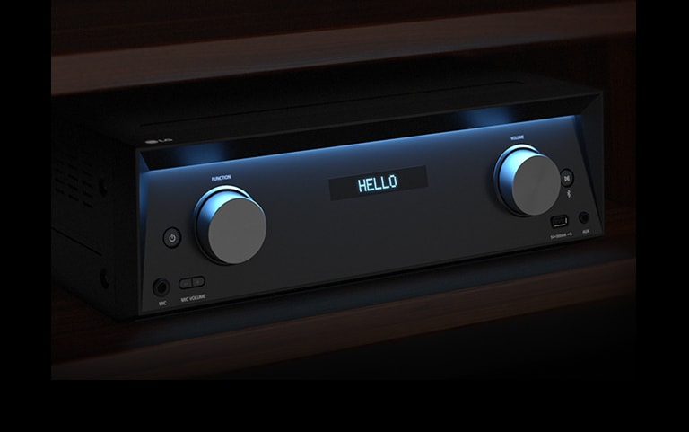 LG MR11's receiver is placed on the shelf with blue lightings on. 'Hello' is shown in the display.