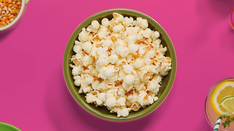 The video shows that a bowl of popcorn is being cooked faster by  LG NeoChef™ than the other one being cooked with conventional microwave oven.