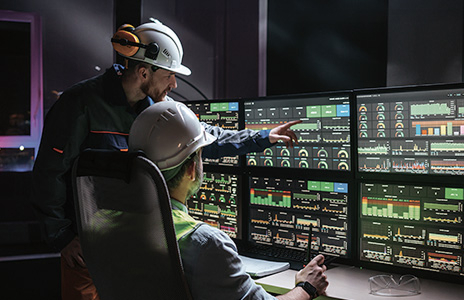 LG Operation AX platform displaying data visualization on multiple screens for optimization. Digitized operational systems with custom software to maximize hardware performance.