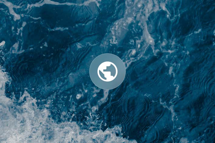 Close-up of ocean surface waves with white foam