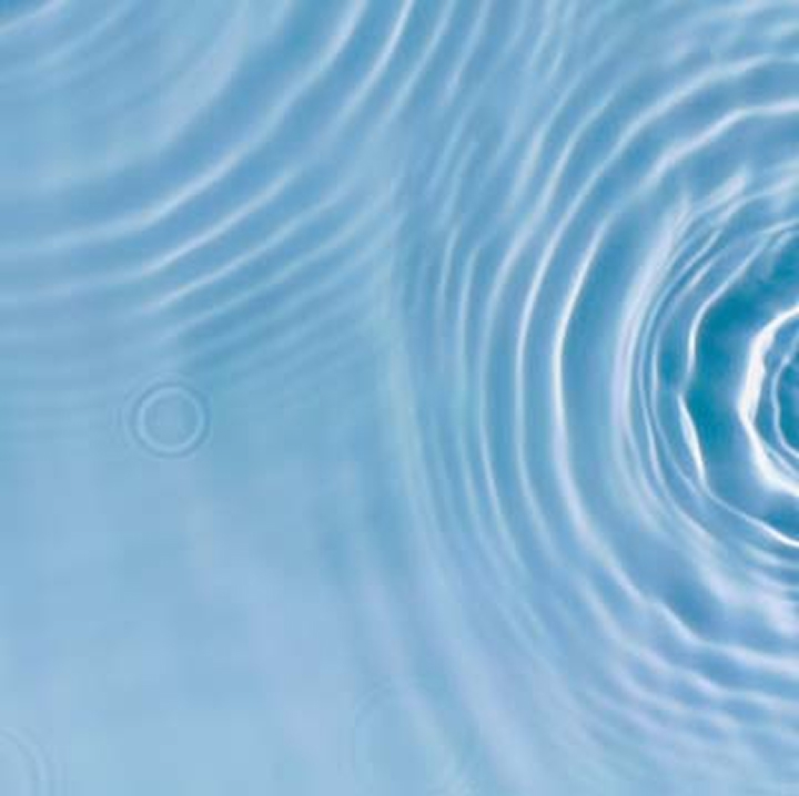 Blue water surface with circular ripples
