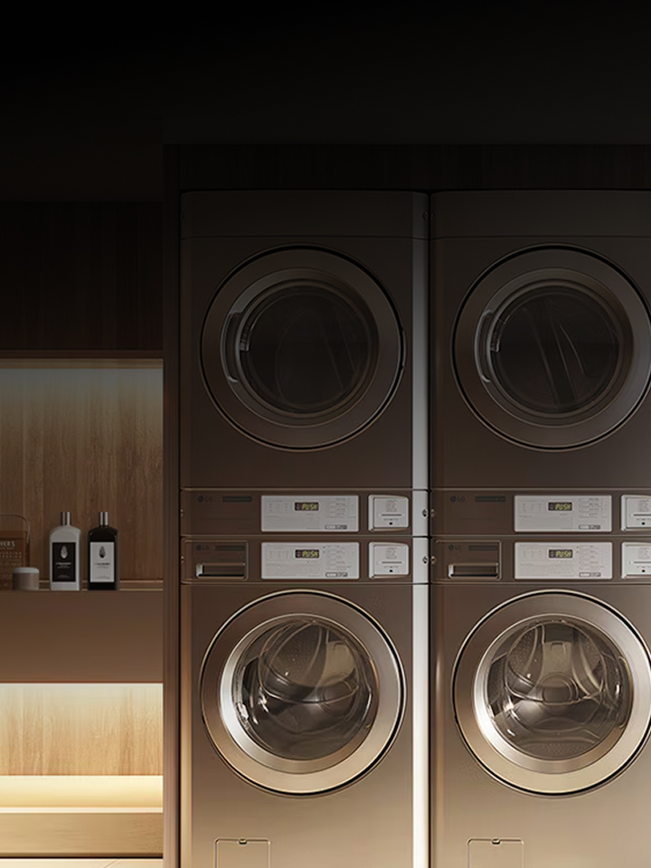 LG Smart Laundry Lounge with stacked commercial washers and dryers alongside wardrobe-style appliance, text overlay LG Smart Laundry Lounge
