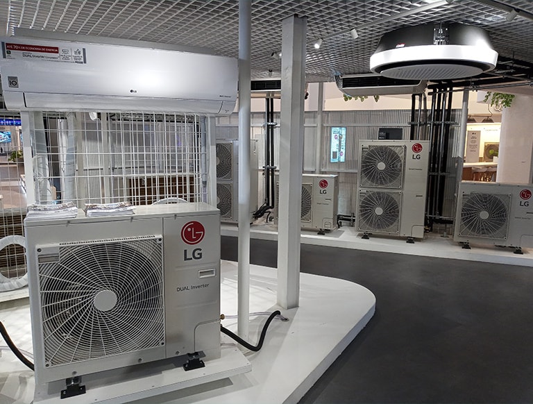 The space is filled with a series of LG outdoor units and ceiling mounted indoor units.