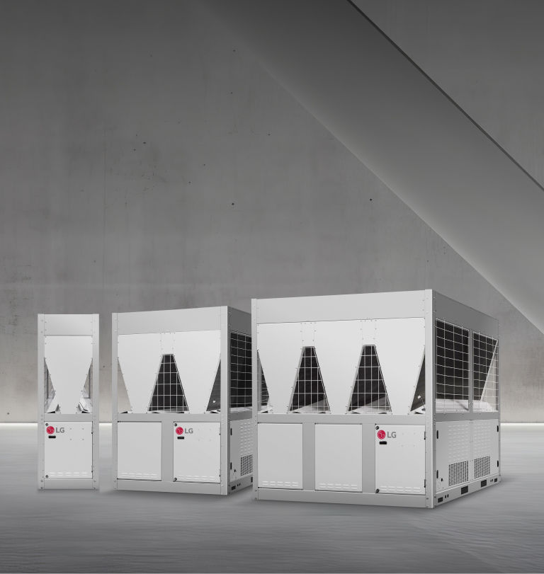 Three LG inverter scroll chillers are displayed in a space with minimalist concrete walls and soft lighting.
