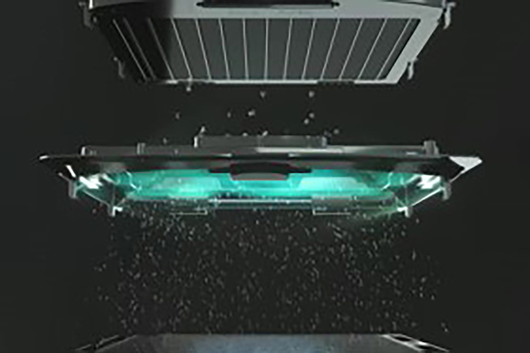 Small dust particles traverse the top-located electrification zone, illuminated in blue.