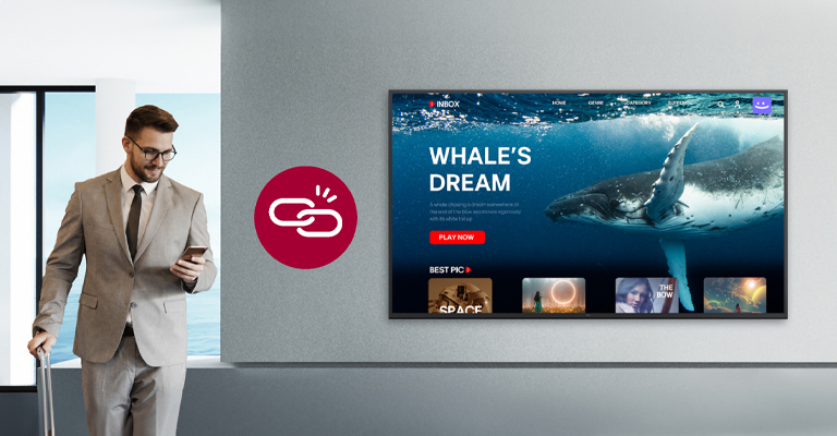 A man is checking out while OTT content is playing on the hotel room TV. The image illustrates a scenario related to the local PMS feature that supports automatic logout upon checkout.