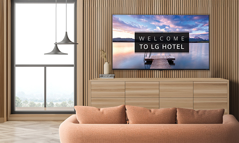 An LG commercial TV is installed in a hotel room.