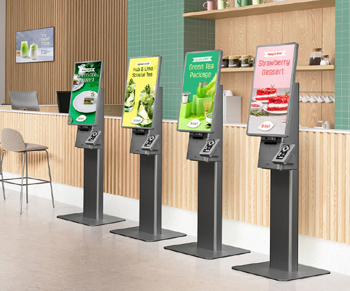 LG Kiosk & Touch self-ordering machines installed in a modern café, displaying menu options for tea and desserts. Fast and convenient LG digital kiosks enhance customer satisfaction with touch-screen ordering solutions.