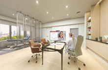 LG digital display in healthcare office enabling remote consultation. LG healthcare solutions supporting telemedicine and patient engagement