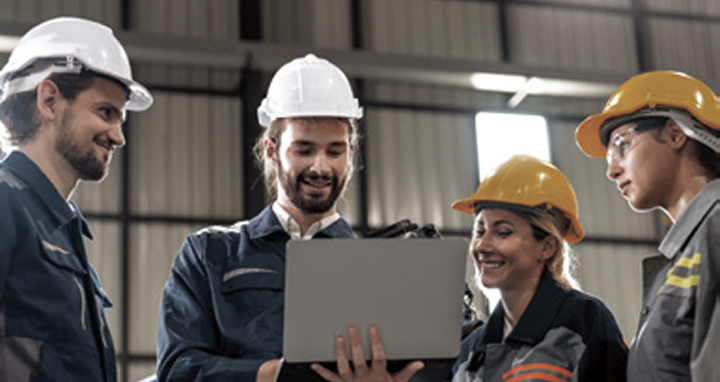 LG consultants and engineers collaborating with safety helmets, representing productivity innovation in industrial lifecycle management.