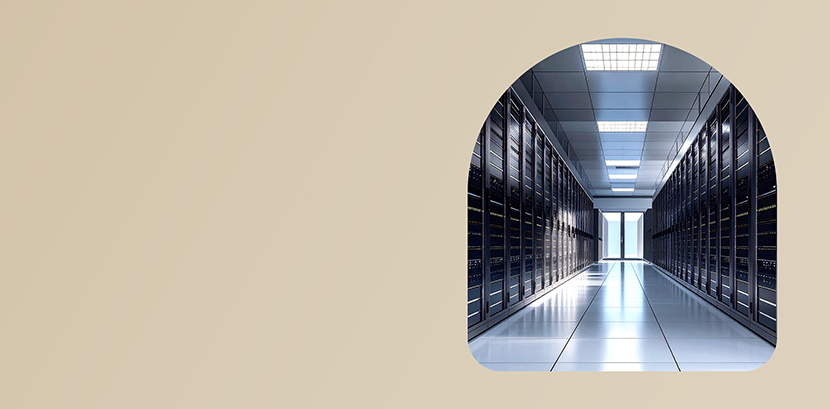 Modern data center corridor with rows of server racks and bright overhead lightin