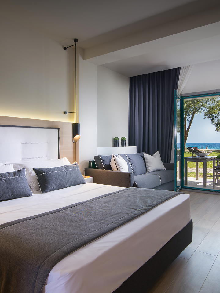 Premium seaside hotel room featuring LG integrated solutions with modern design, open terrace view, and smart in-room technology for a refined guest experience.