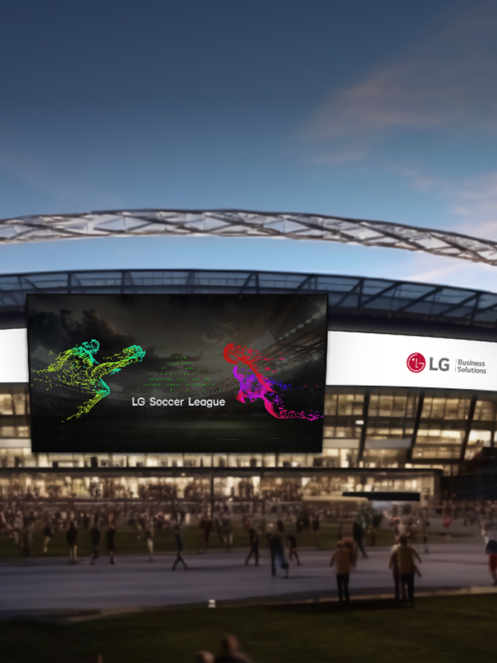 LG integrated public facility solutions visual showing a modern stadium exterior with large LG digital signage screens displaying “Life’s Good” and “LG Soccer League” for smart public spaces.