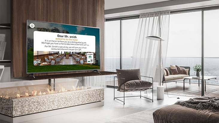 An LG commercial TV is installed in a resort room.