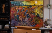 An image of The Red Vineyards at Arles on an easel.