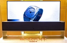 An image of a Rollable OLED TV R showing a Bulgari watch onscreen.