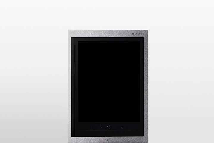 The front view of a black glass InstaView refrigerator with the light on inside. Hands tapping on InstaView screen.	