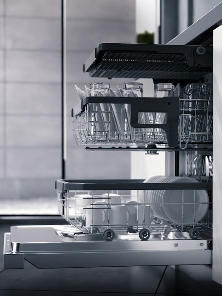 Close up view of dishes and glasses being washed by using true steam feature of LG freestanding dishwasher.	