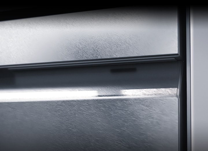 Close shot of LG SIGNATURE Dishwasher's textured steel finish.