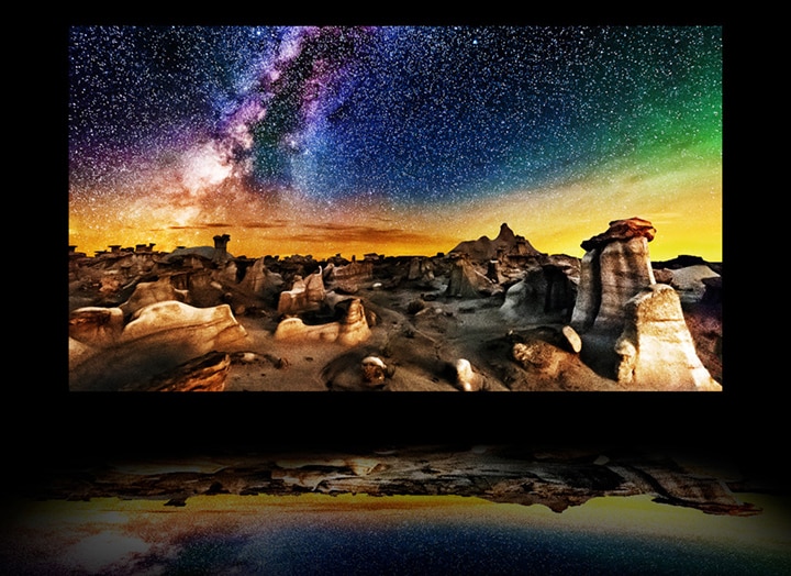 A video of a TV's layers with a starry nighttime landscape photograph on the main OLED display. The backlight disappears, and the polarizer, color filter, and OLED come together to produce an image so bright that it reflects below the TV like on water.