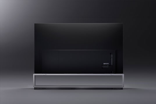 Image of the LG SIGNATURE OLED 8K taken from behind. The image shows the back of the TV, including the base and connectivity ports, against a dark backdrop.