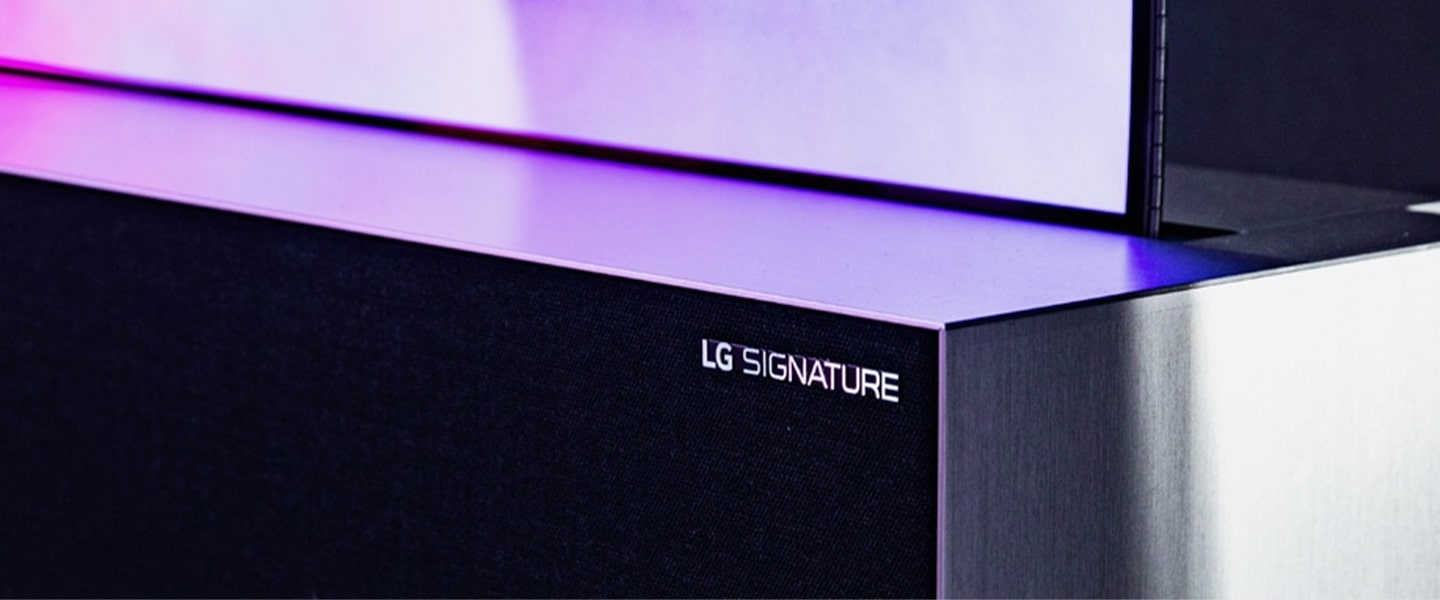 An image of LG SIGNATURE Rollable OLED TV Speaker located in a grey-colored space.